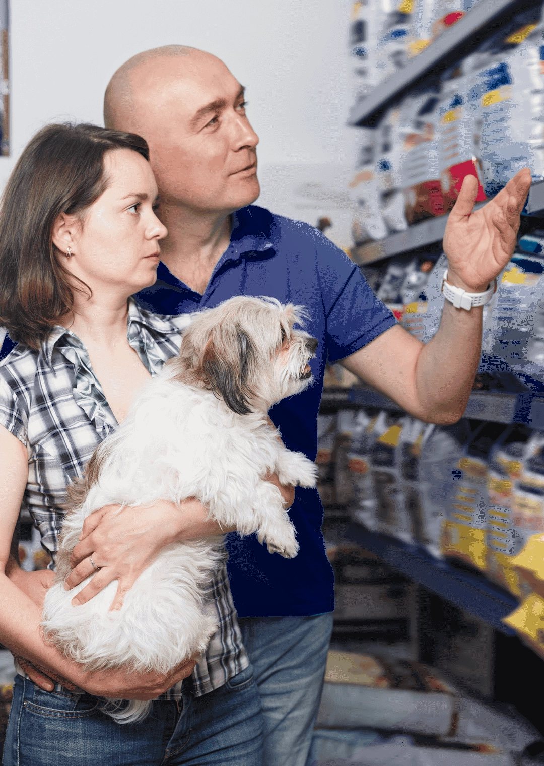 Nice couple with dog buying food for dogs